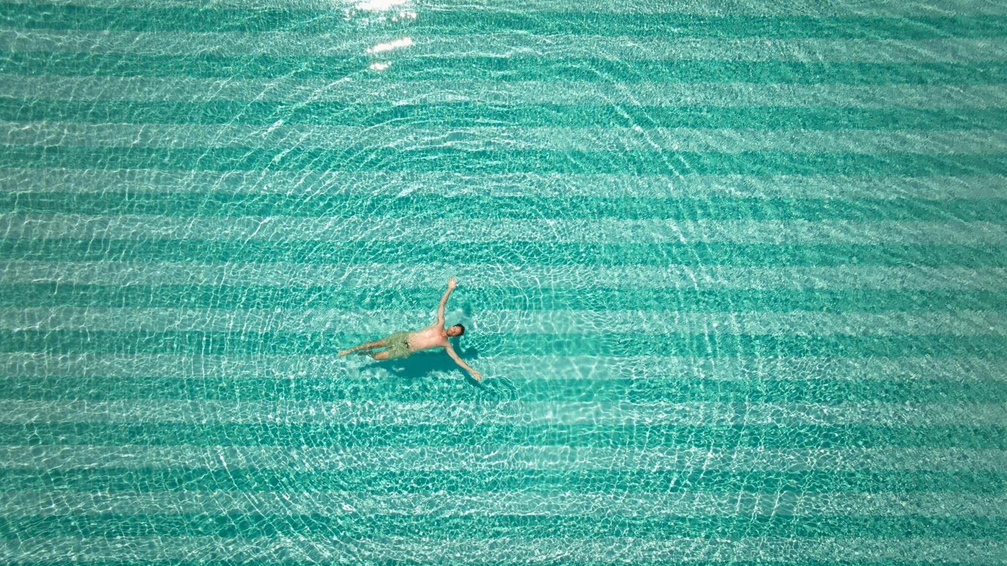 Secrets Sunny Beach Resort & Spa (Adults Only) Εξωτερικό φωτογραφία A man floating in the Dead Sea