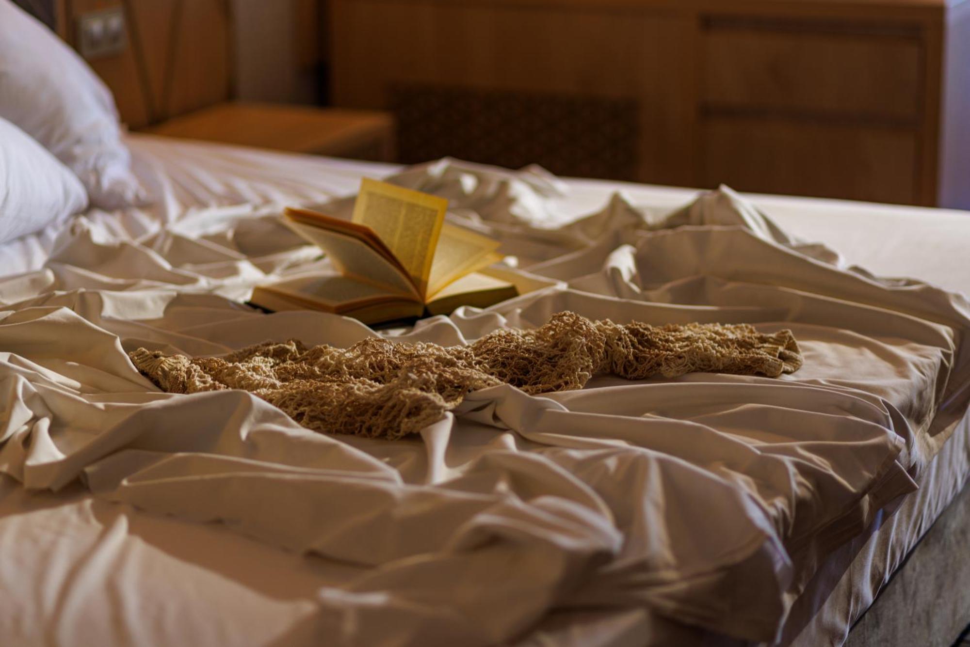 Secrets Sunny Beach Resort & Spa (Adults Only) Εξωτερικό φωτογραφία A bed with a book and a cat
